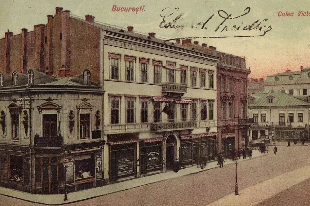 Colour lithograph of Calea Victoriei, Bucharest, in 1900, with the street's first buildings along a dirt road.
