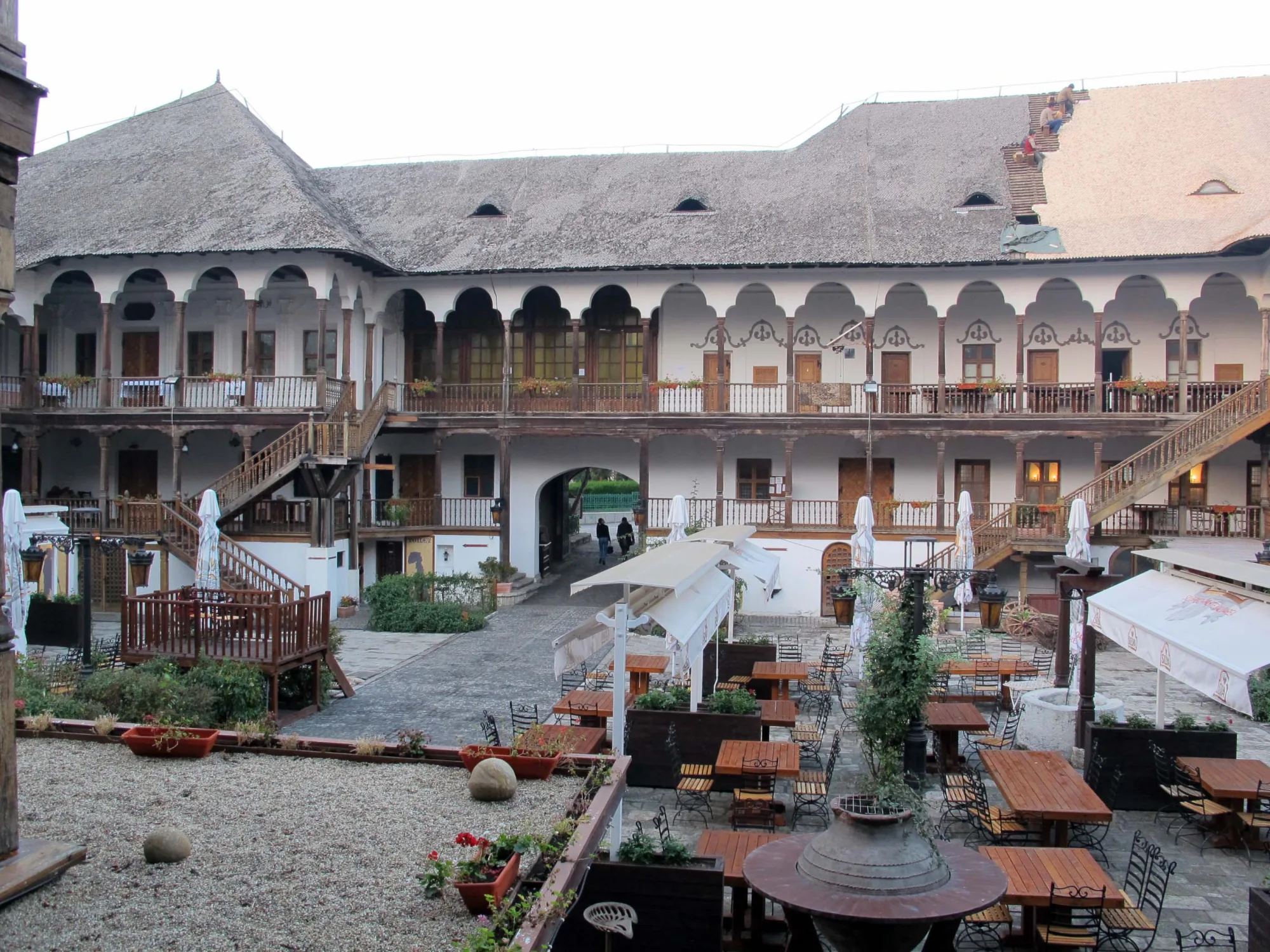 The wooden galleries and courtyard of Hanul lui Manuc today